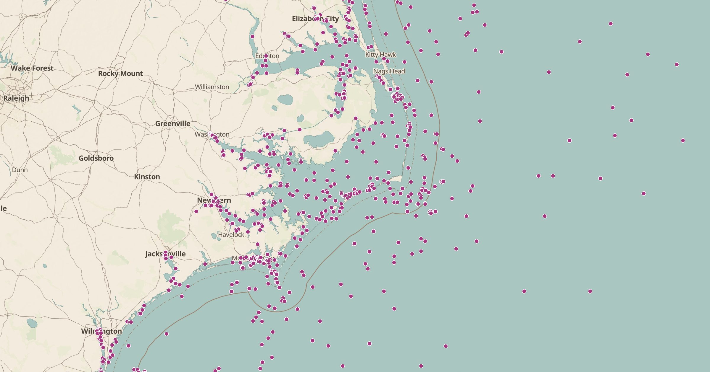 Map of the North Carolina coast and Outer Banks covered in light-blue dots marking charted shipwrecks and obstructions