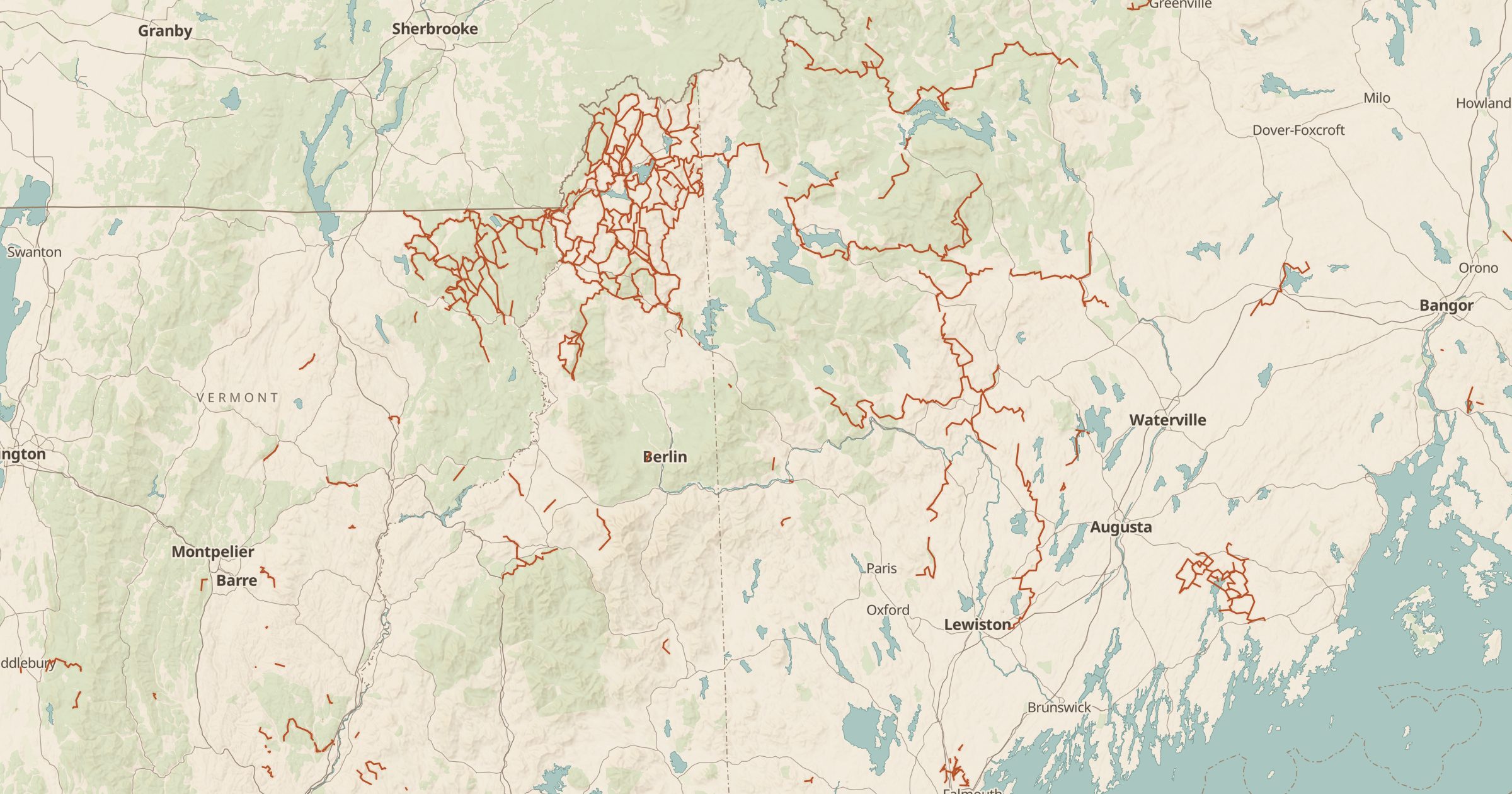 Map of New Hampshire and Maine with the Snowmobile Trails (OSM) layer turned on in Bottomless Maps